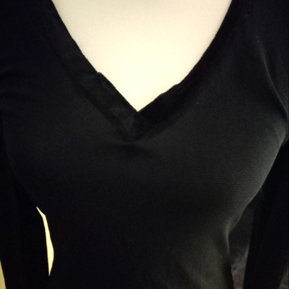 Used,not new black semi sheer mesh long sleeve fitted top with  velour  neck.